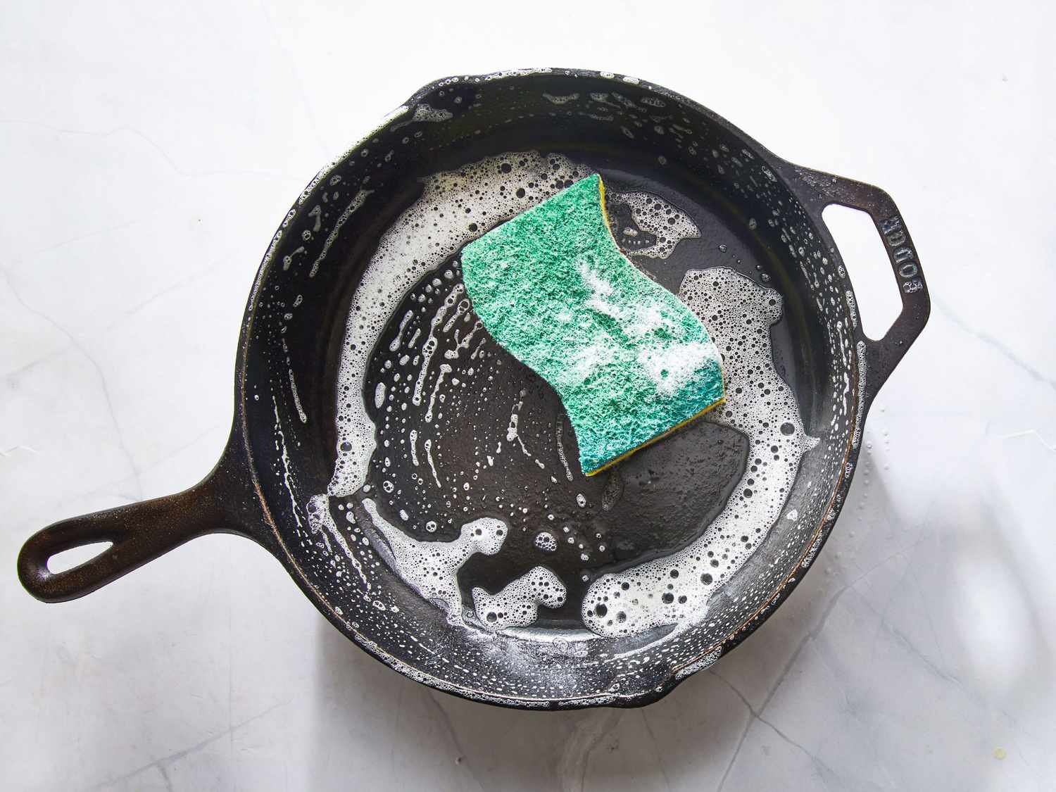 how to get burnt food off cast iron