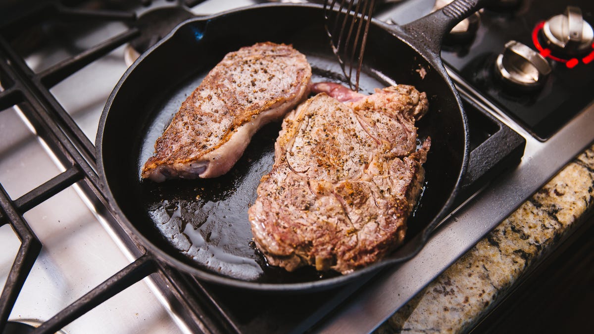 how to remove baked on grease from cast iron skillet