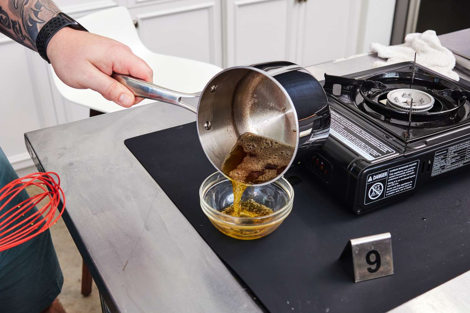 what is the correct way to to lift the lid off a saucepan